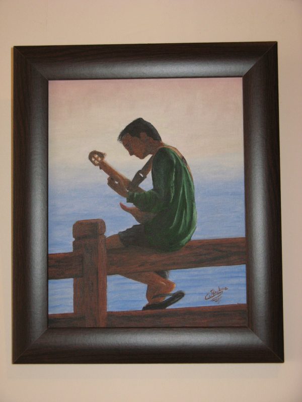 Cuadro realista pintado a mano con oleo sobre tablilla de un chico joven compositor musico tocando la guitarra